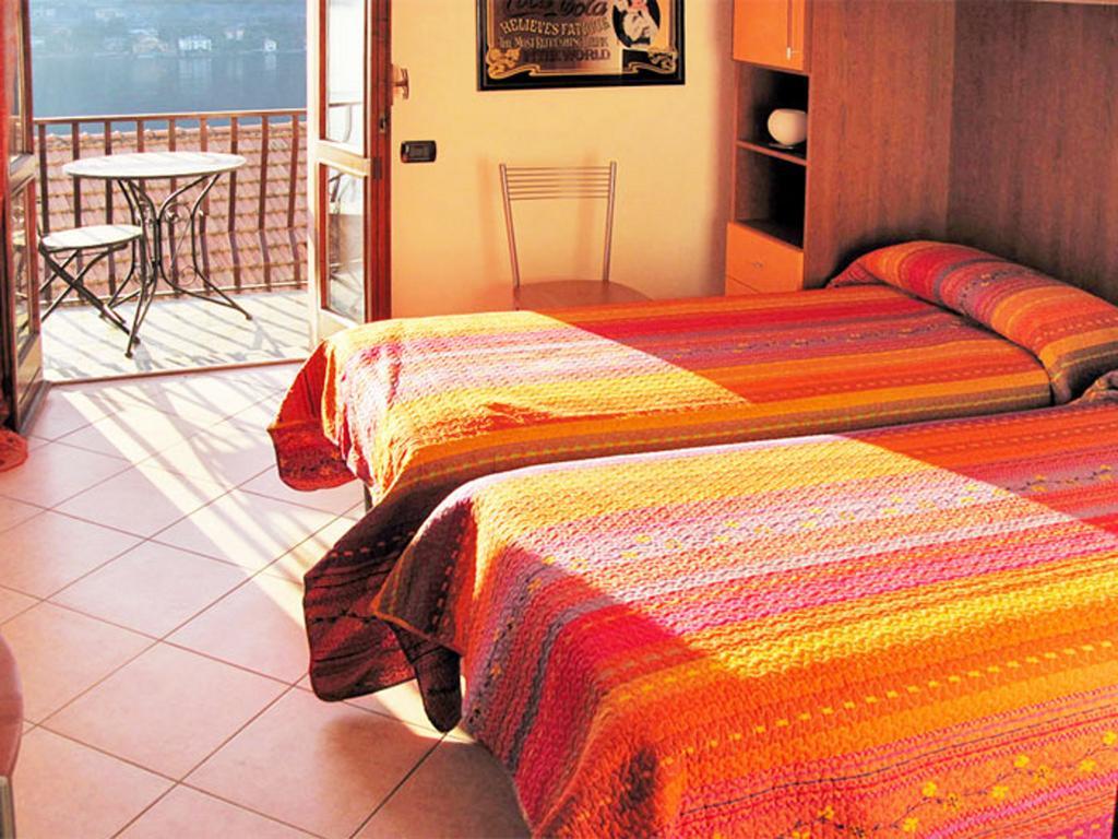 Villa Pinky House Nesso Habitación foto